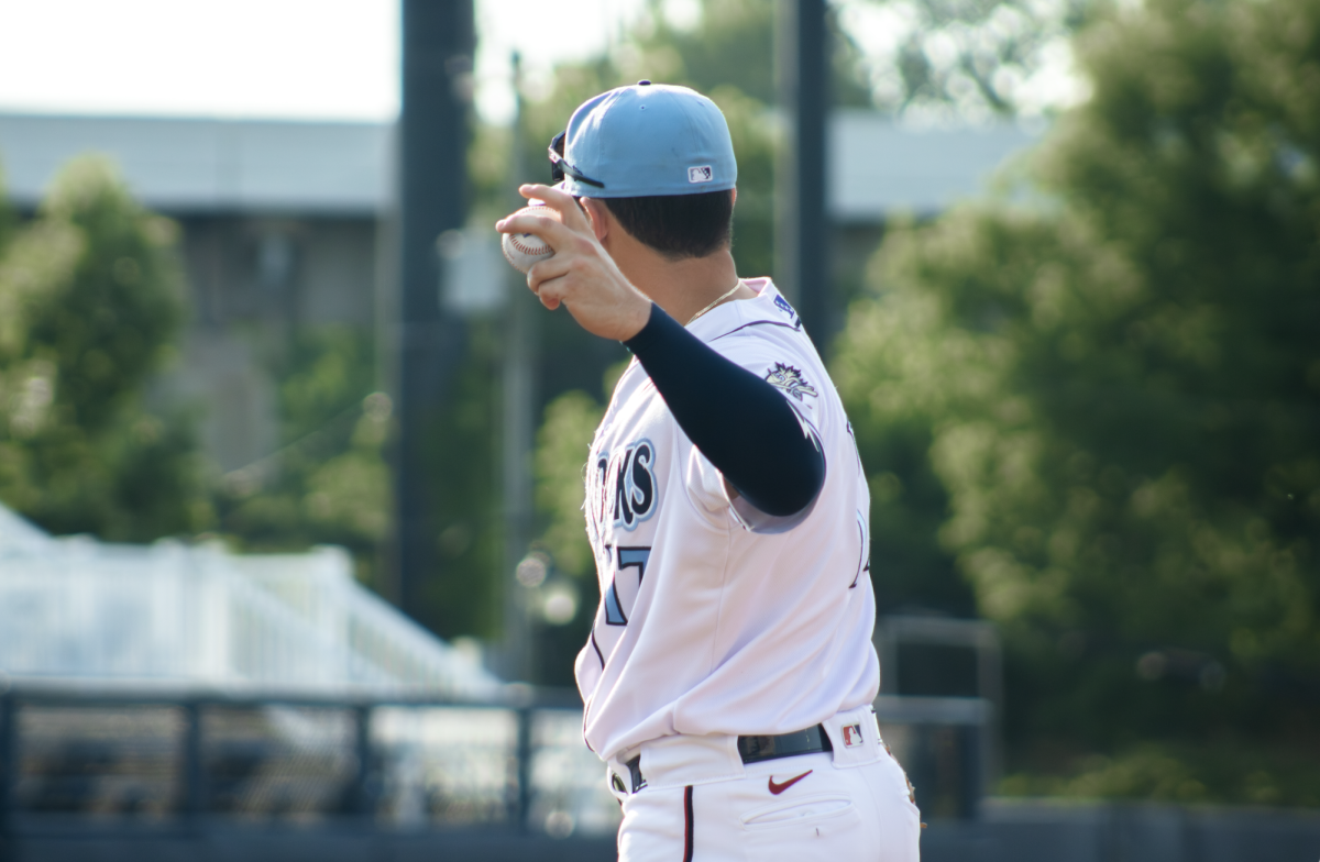 Branden Boissiere warms up the infield. - Photo via Hannah Capolingua